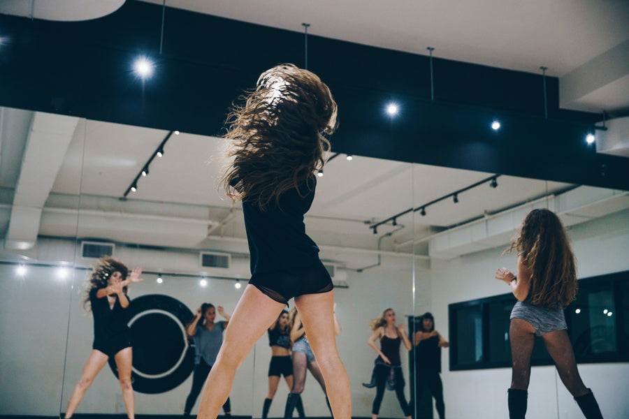 Full height mirror wall Installed in a dance studio